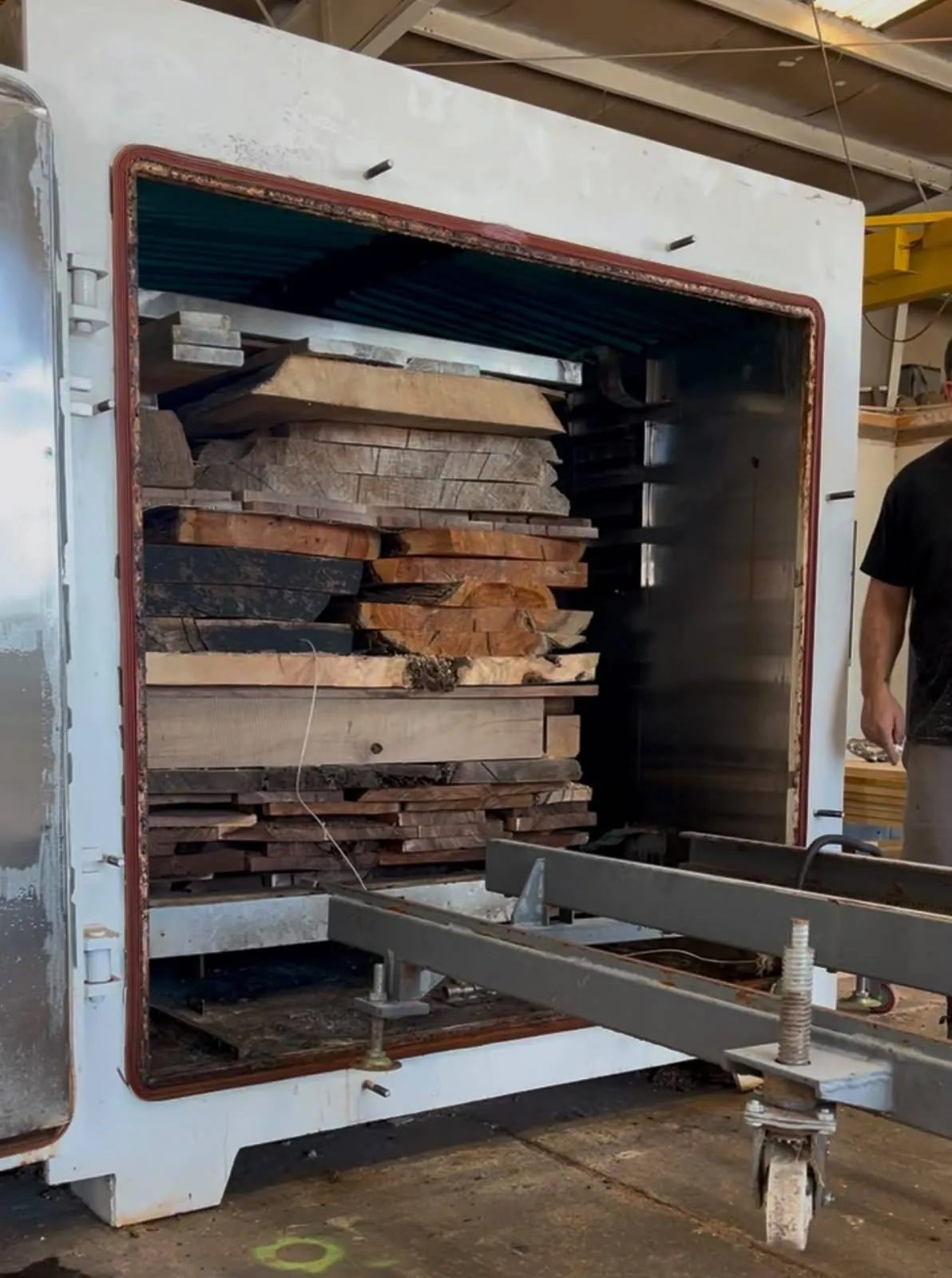 Boards and slabs stacked inside the radio-frequency kiln at Urban Wood Company