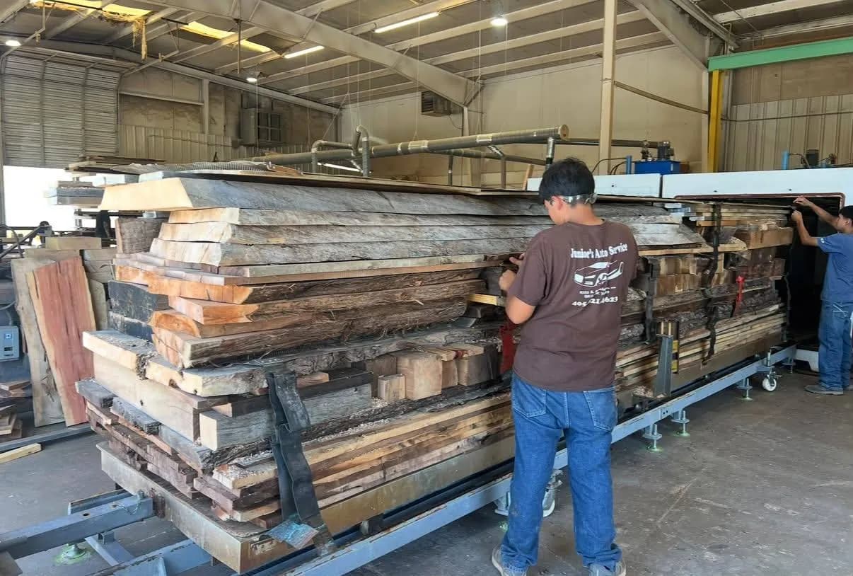 Workers preparing a large stack of lumber for the radio-frequency kiln at Urban Wood Company