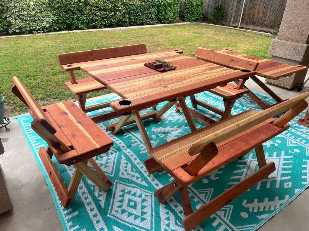 Michael Frazier Coastal Redwood table with benches opened around the patio seating area